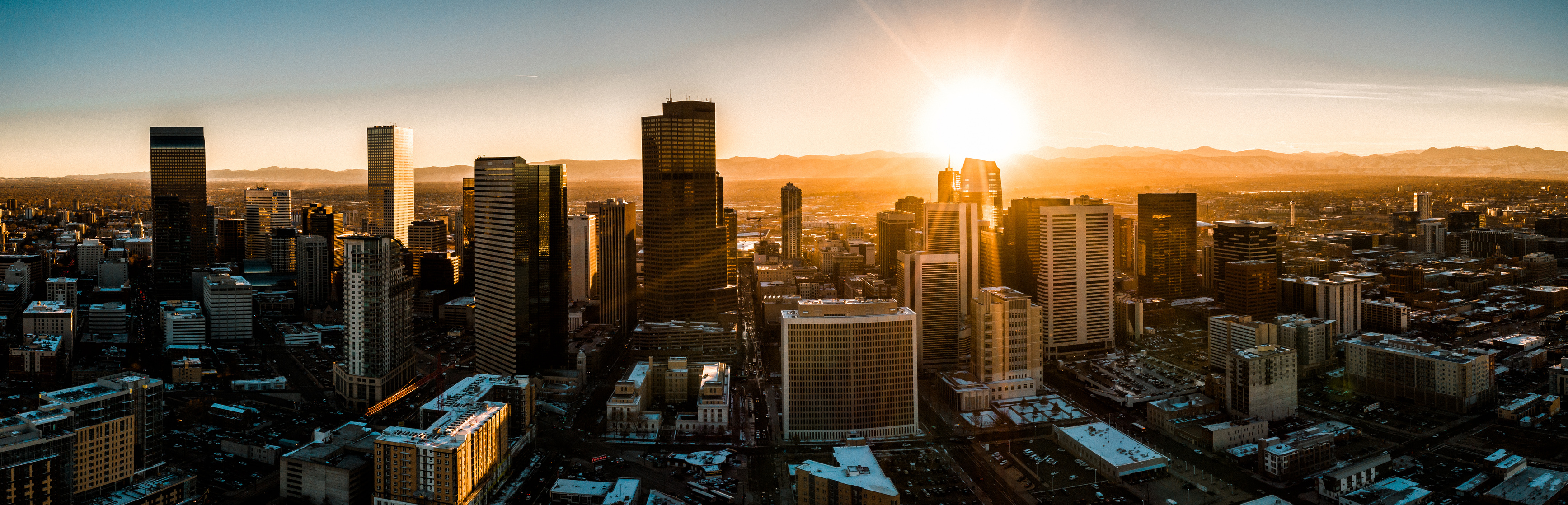 Aerial drone photo - City of Denver Colorado at sunset.